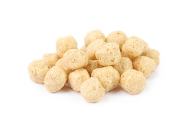 Pile of tasty corn balls on white background, closeup. Healthy breakfast cereal