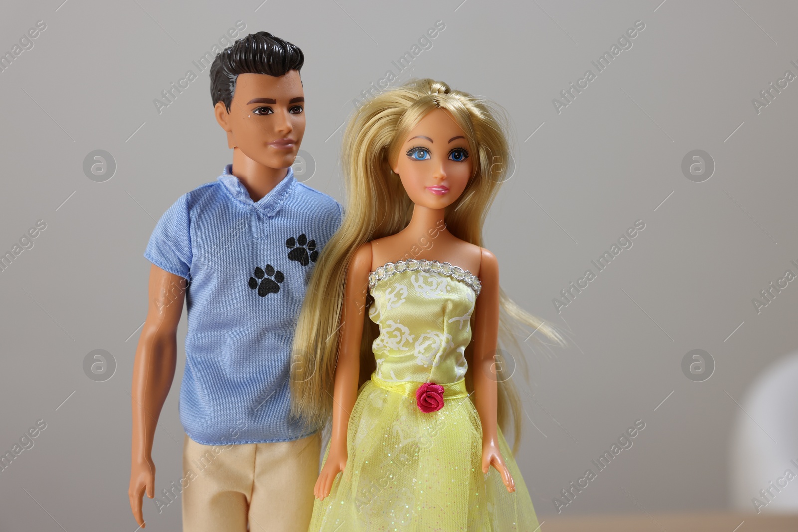 Photo of Leiden, Netherlands - September 20, 2023: Stylish Barbie and Ken dolls on light gray background