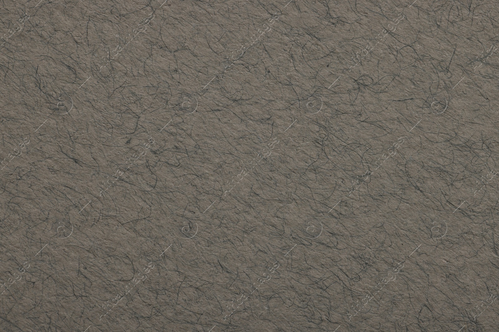 Photo of Texture of grey paper sheet as background, top view