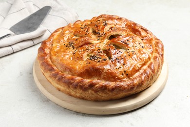 Photo of Tasty homemade pie with filling on light table