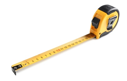 Photo of Metal measuring tape on white background. Construction tool