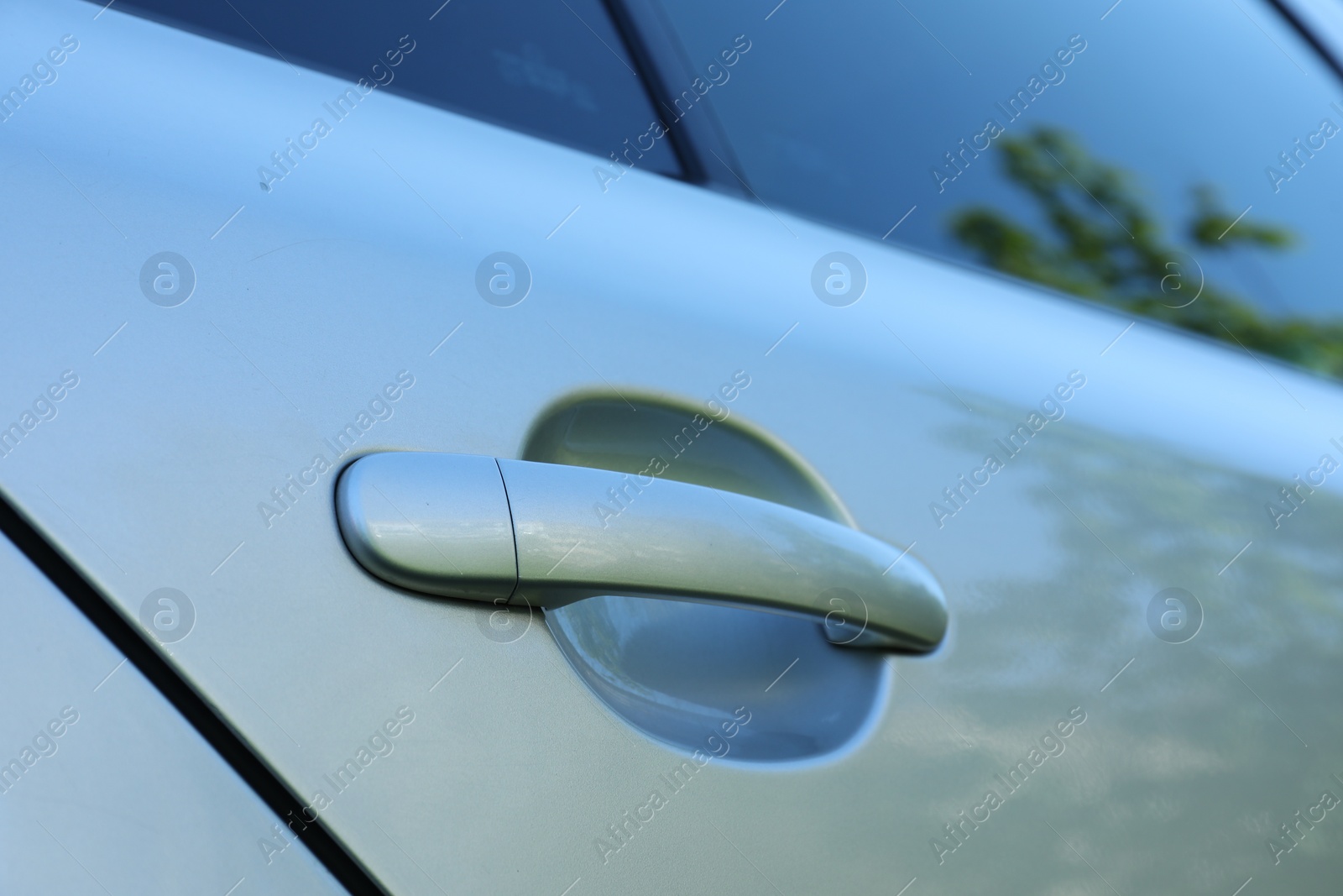 Photo of Closeup view of car door with handle