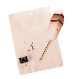 Photo of Parchment with stains of ink, feather pen and inkwell on white background, top view