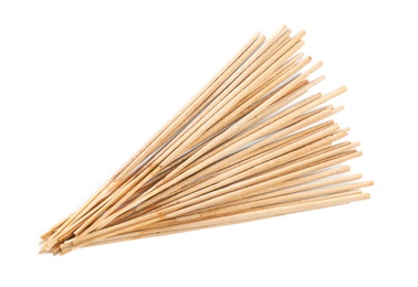 Photo of Many aromatic incense sticks on white background