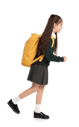 Photo of Little girl in stylish school uniform on white background