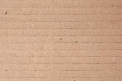 Texture of beige paper sheet as background, closeup