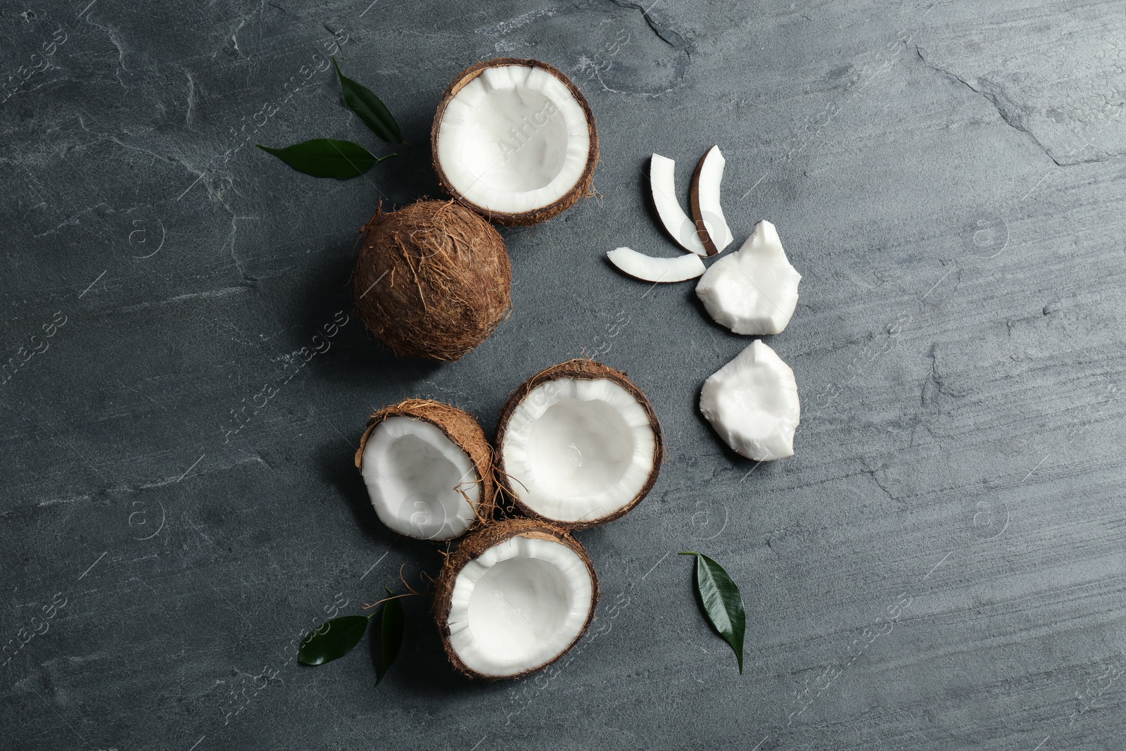 Photo of Flat lay composition with coconuts on grey table