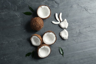 Flat lay composition with coconuts on grey table