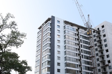 View of unfinished building against blue sky