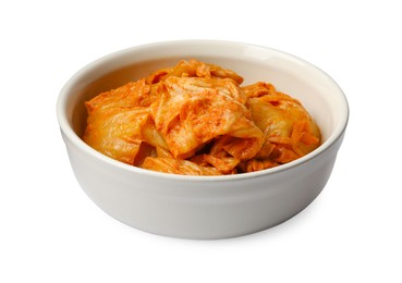 Photo of Bowl of spicy cabbage kimchi isolated on white