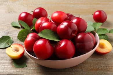 Fresh ripe cherry plums on wooden table, closeup