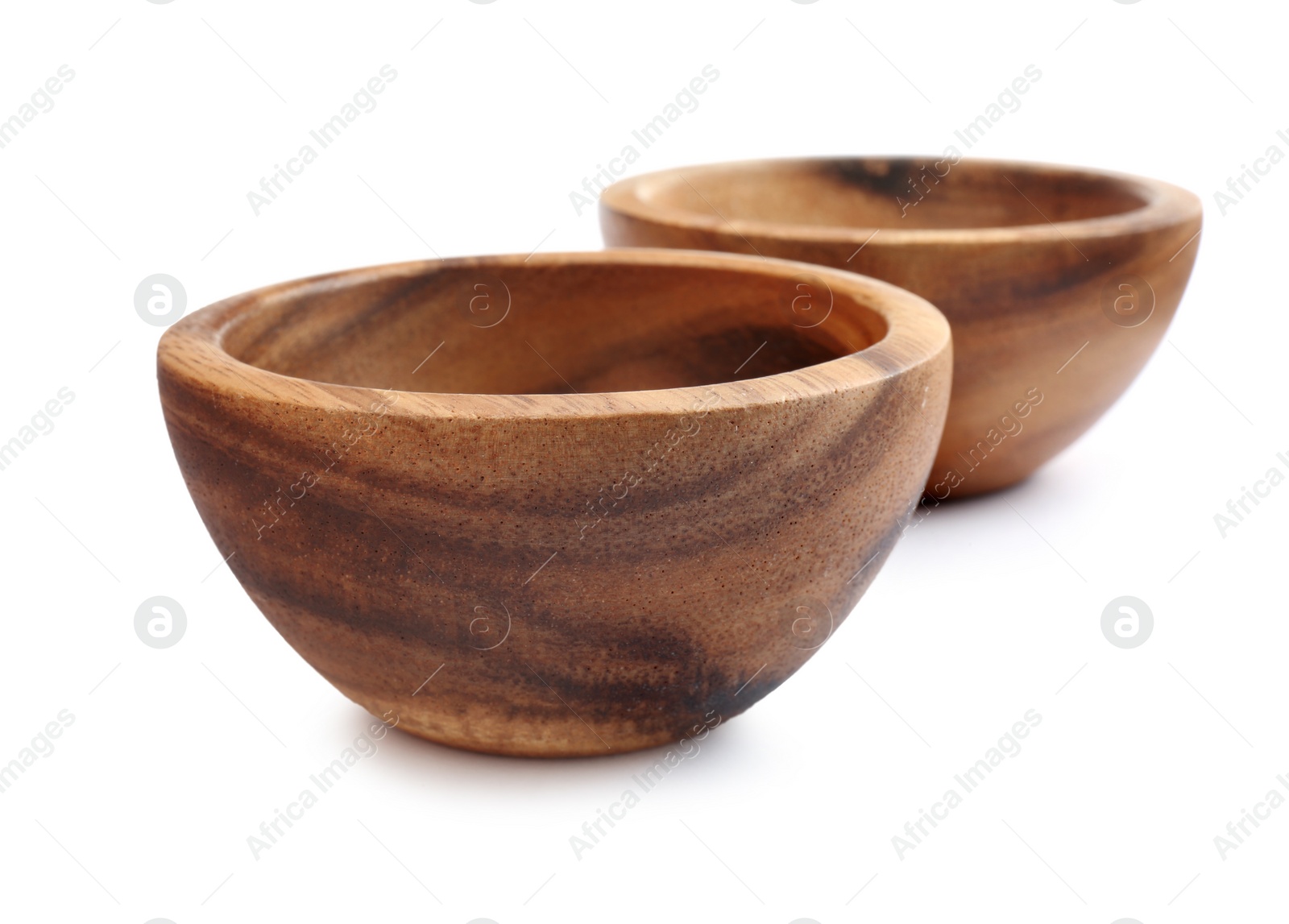 Photo of Two new wooden bowls on white background