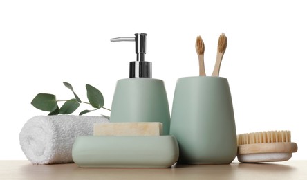 Bath accessories. Different personal care products and eucalyptus branch on wooden table against white background
