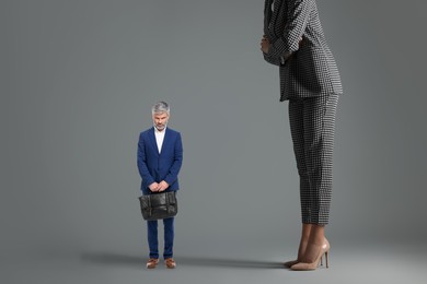 Image of Giant woman and sad small man on grey background