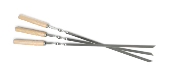 Photo of Metal skewers with wooden handle on white background, top view