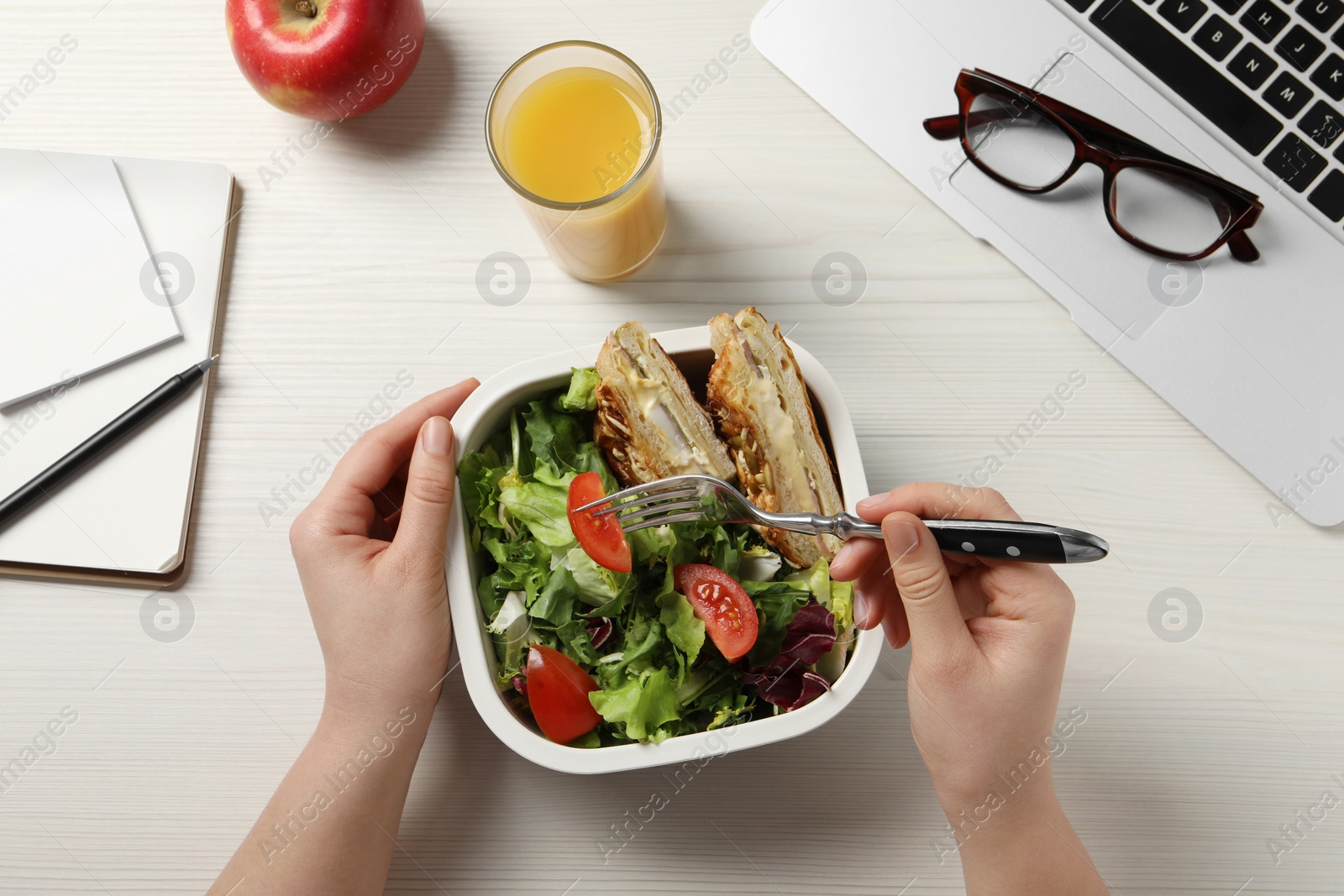 Photo of Office employee having business lunch at workplace, top view