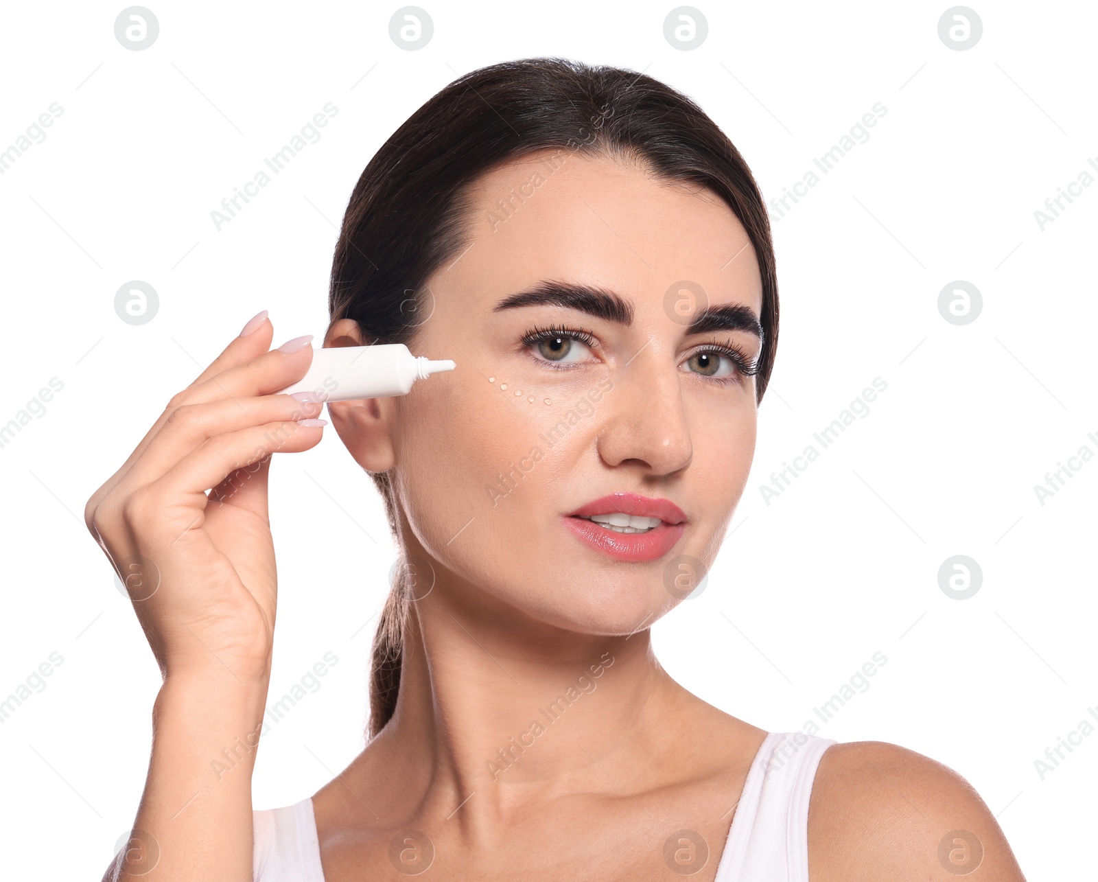 Photo of Woman with cosmetic product around eye on white background. Skin care