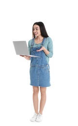 Photo of Full length portrait of young woman in casual outfit with laptop on white background