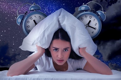 Image of Two alarm clocks and annoyed young woman covering ears with pillow in night