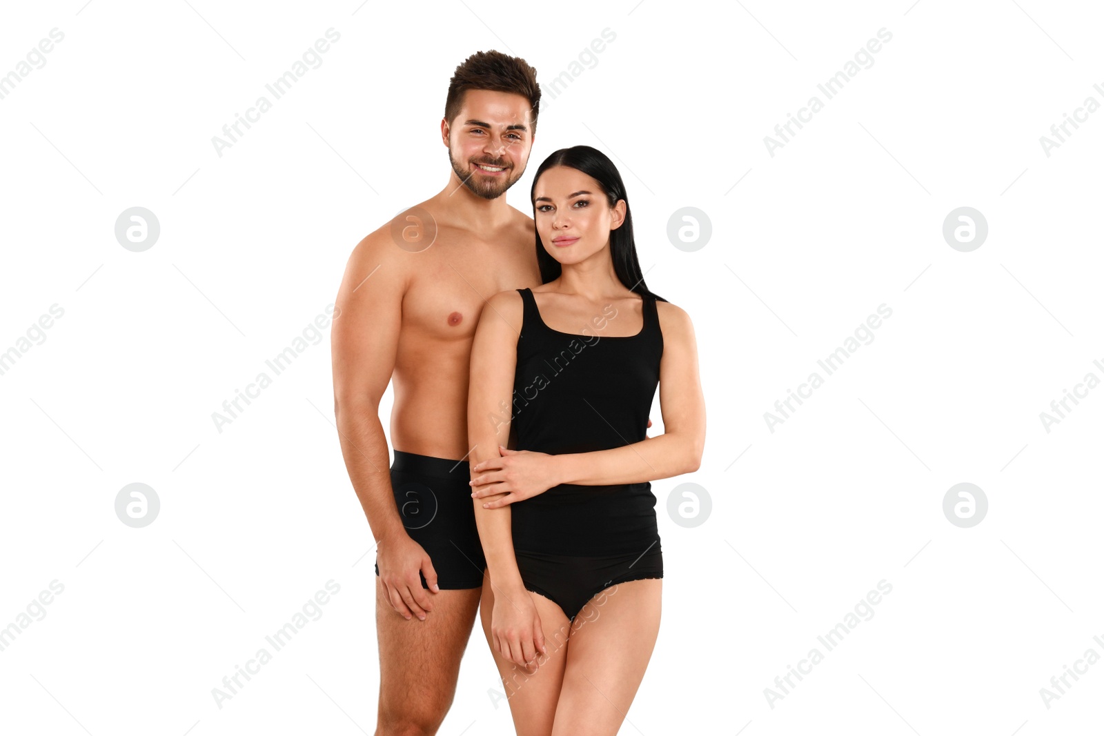 Photo of Young couple in black underwear on white background