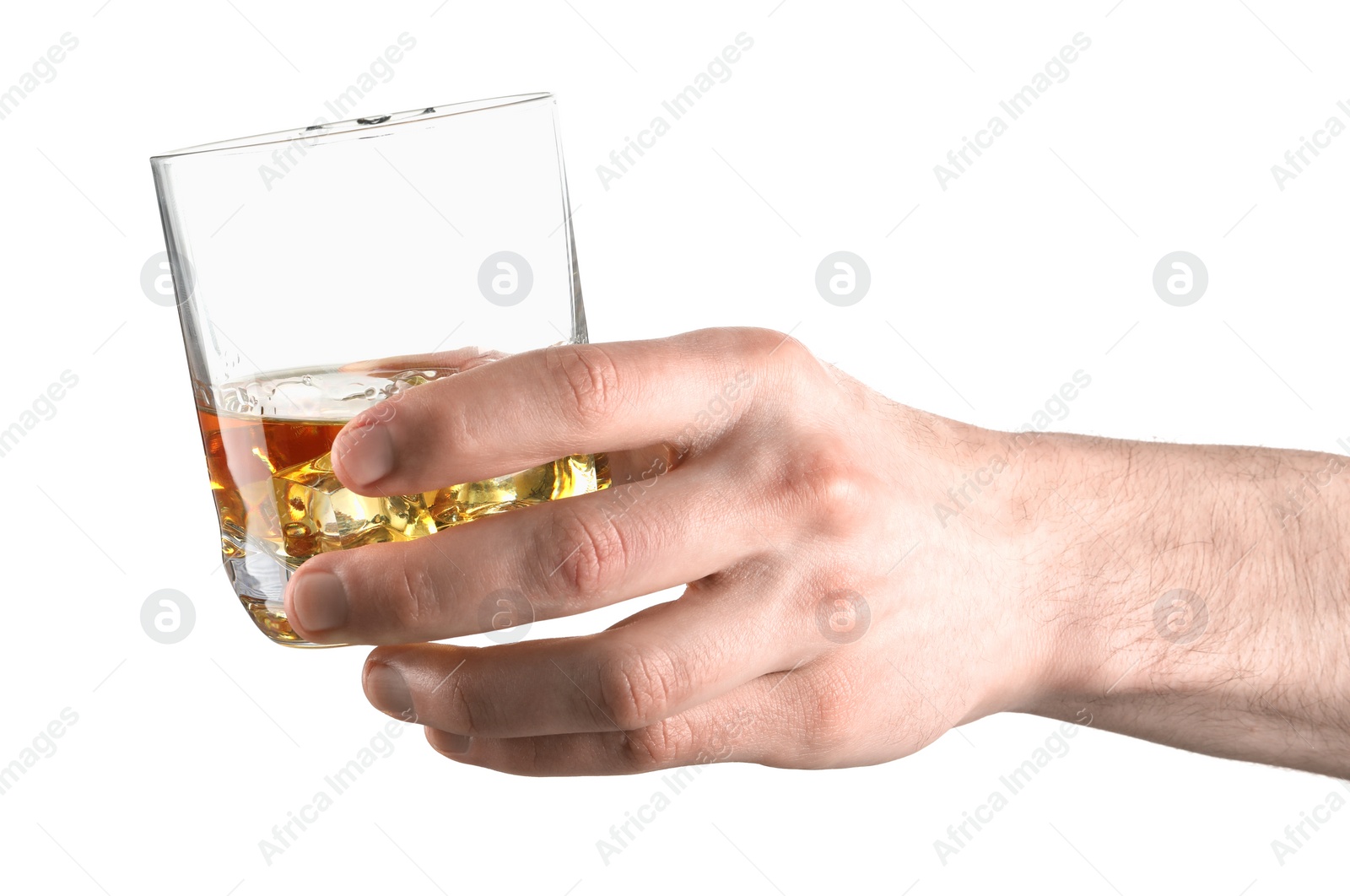 Photo of Man holding glass of whiskey with ice cubes on white background, closeup