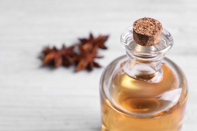 Photo of Bottle of anise essential oil, closeup. Space for text