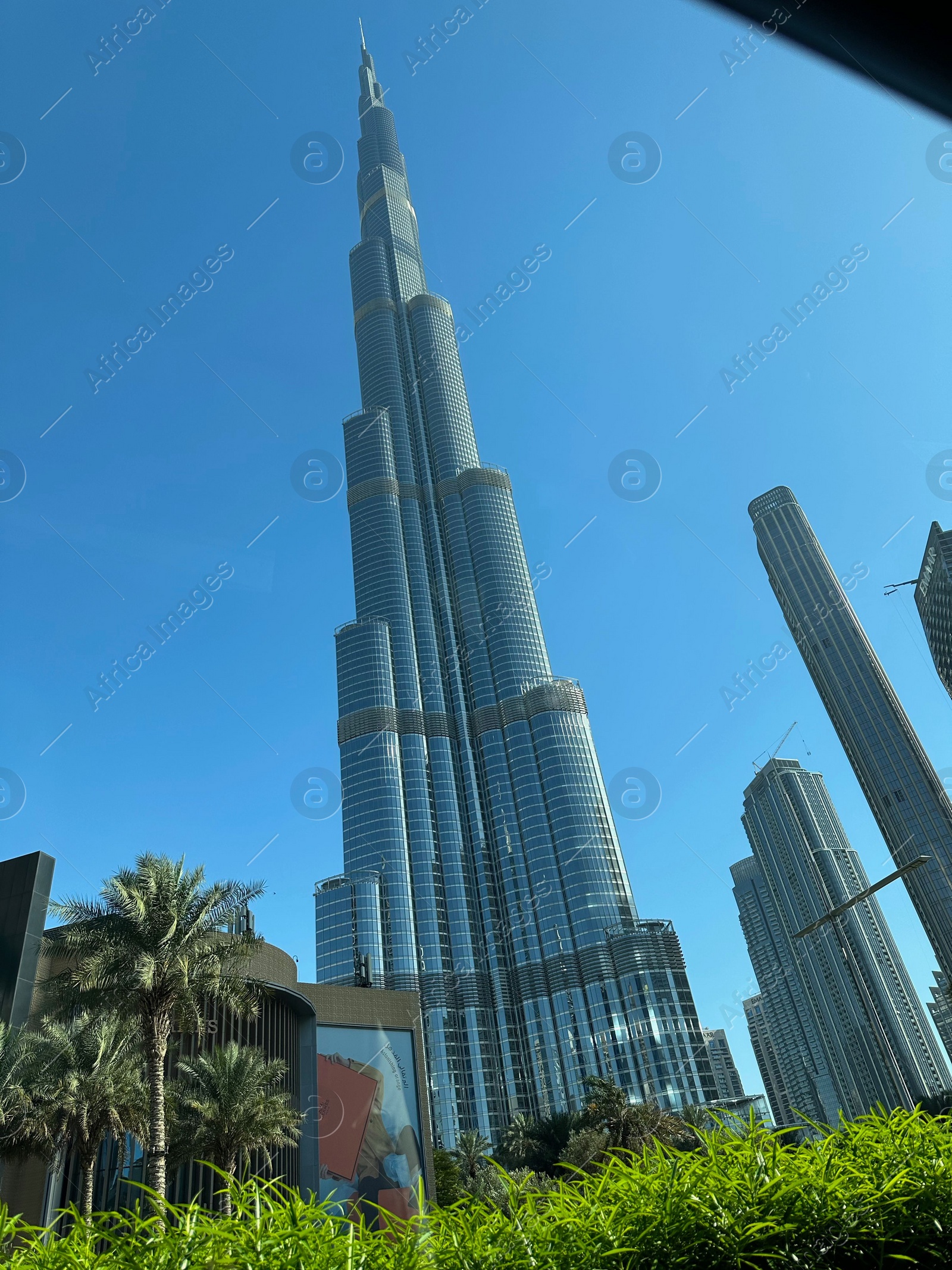 Photo of Dubai, United Arab Emirates - May 2, 2023: Beautiful view of Burj Khalifa in city under blue sky