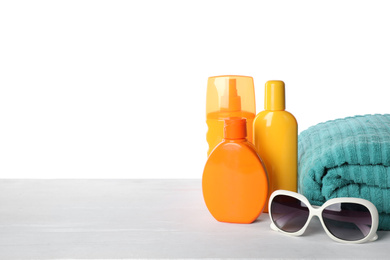 Photo of Sun protection products and beach accessories on table against white background. Space for text