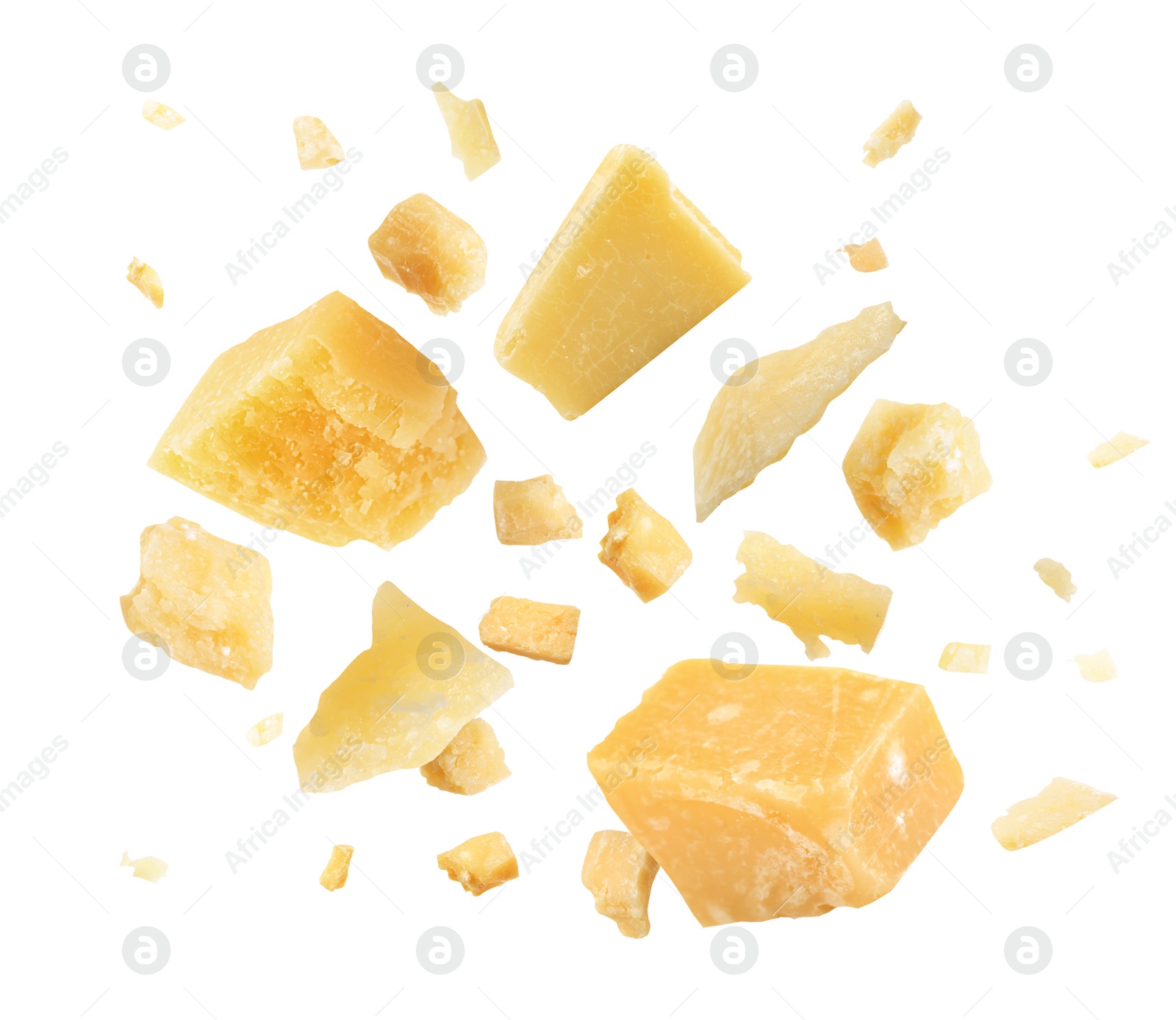 Image of Pieces of delicious parmesan cheese flying on white background