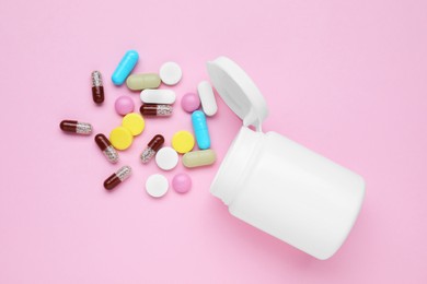 Photo of Bottle and antidepressant pills on pink background, flat lay