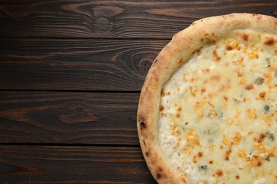 Delicious cheese pizza on wooden table, top view. Space for text