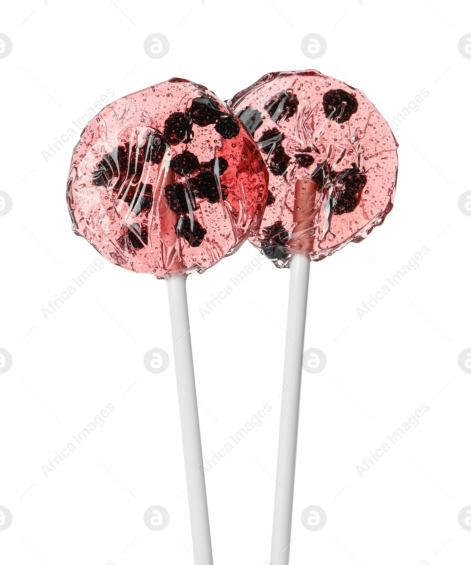 Photo of Sweet colorful lollipops with berries on white background