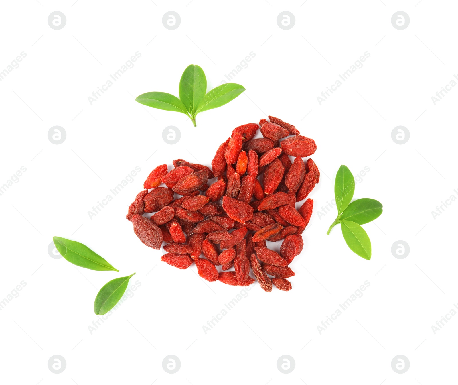 Photo of Heart shaped pile of dried goji berries and leaves on white background, top view