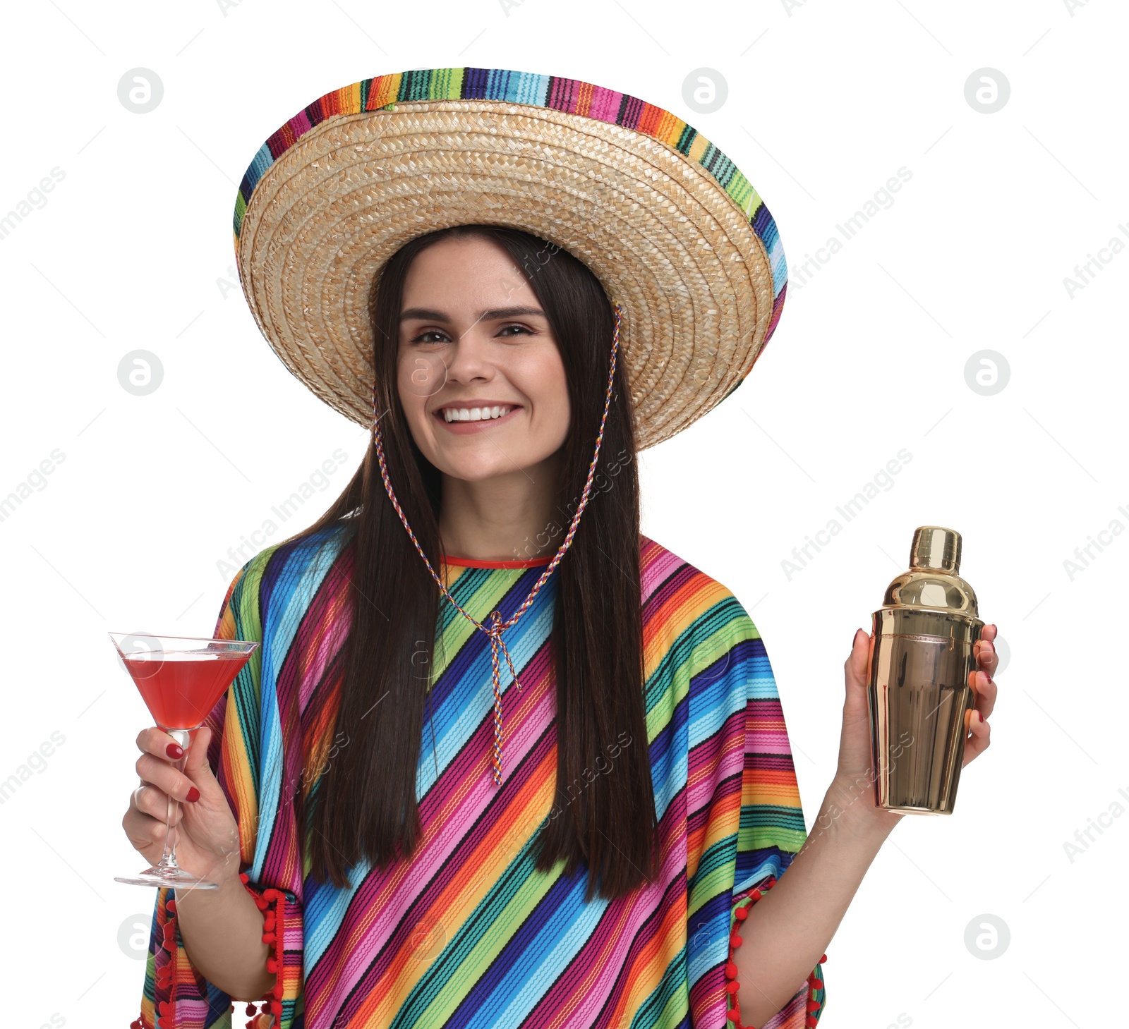 Photo of Young woman in Mexican sombrero hat and poncho with shaker and cocktail on white background