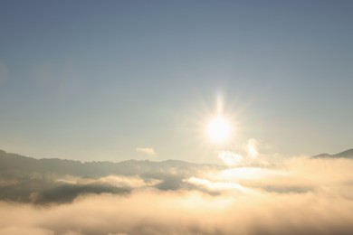 Photo of Aerial view of beautiful mountain landscape with thick mist at sunrise