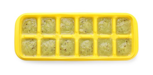 Photo of Kiwi puree in ice cube tray isolated on white, top view. Ready for freezing