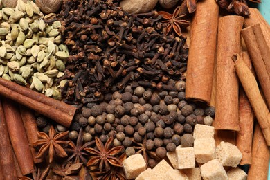 Different aromatic spices as background, top view