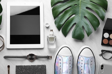 Flat lay composition with tablet on grey background, space for text. Blogger's workplace