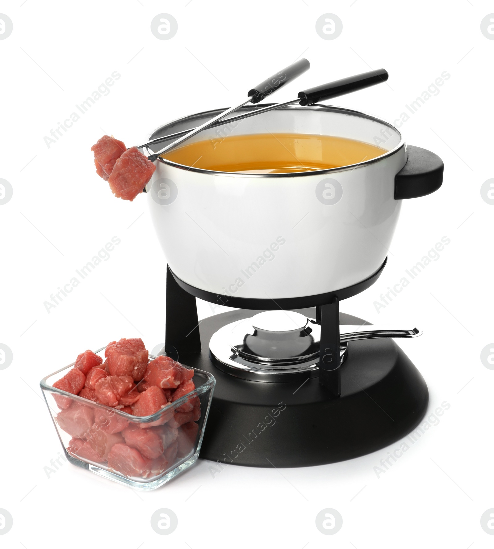 Photo of Fondue pot with oil and raw meat on white background