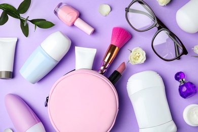 Photo of Flat lay composition with natural female  deodorants on violet background