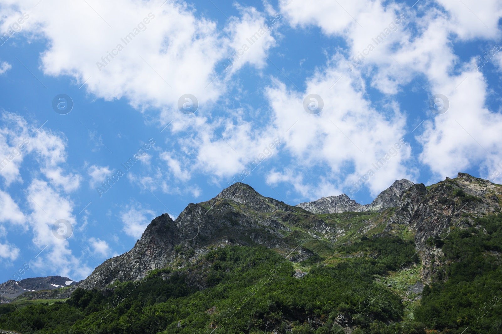 Photo of Picturesque view of mountains under cloudy sky