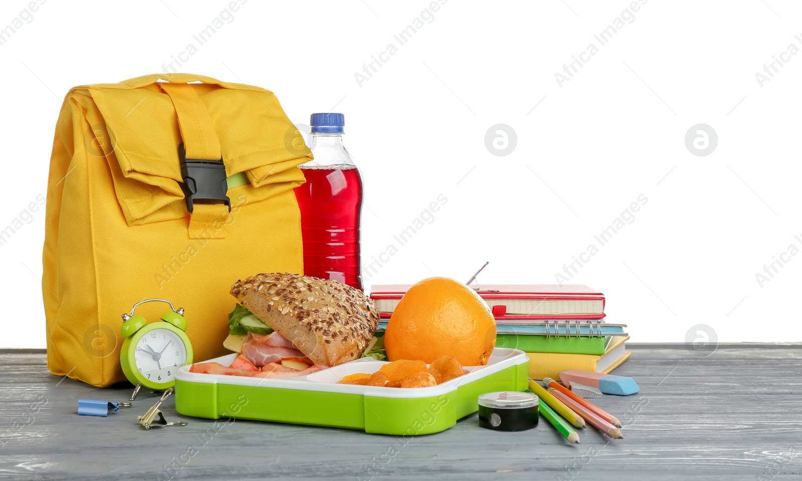 Photo of Composition with lunch box and food on table against white background