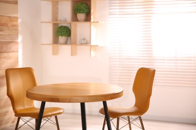 Modern dining room interior with stylish wooden table