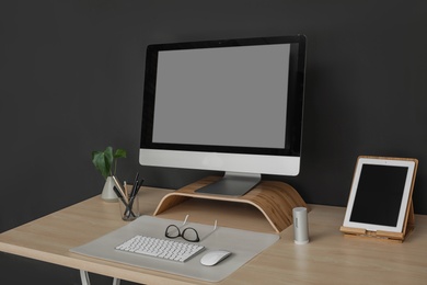 Modern workplace interior with computer on table. Space for text