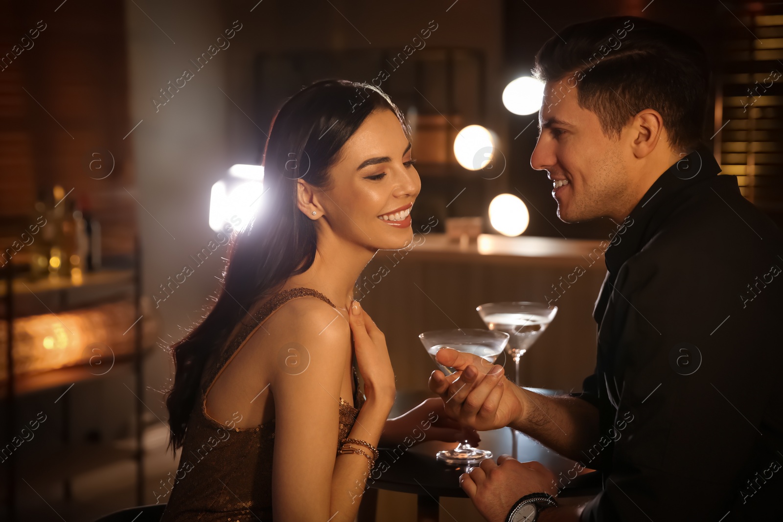 Photo of Man and woman flirting with each other in bar