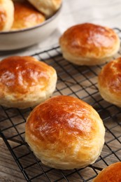 Photo of Tasty scones prepared on soda water on wooden table