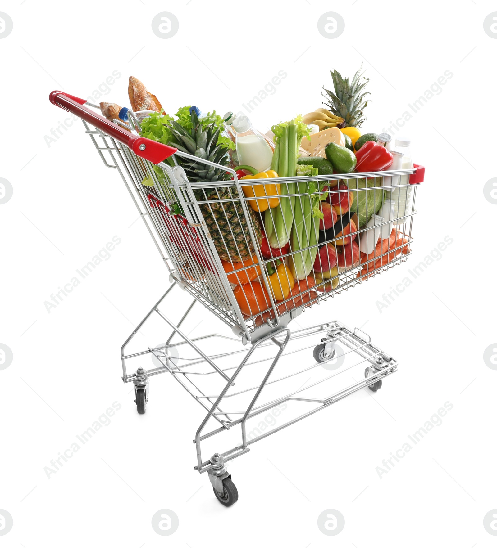 Photo of Shopping cart with groceries on white background