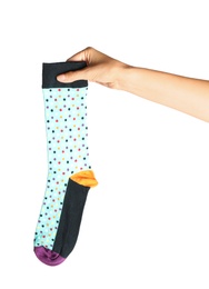 Photo of Woman holding colorful sock on white background