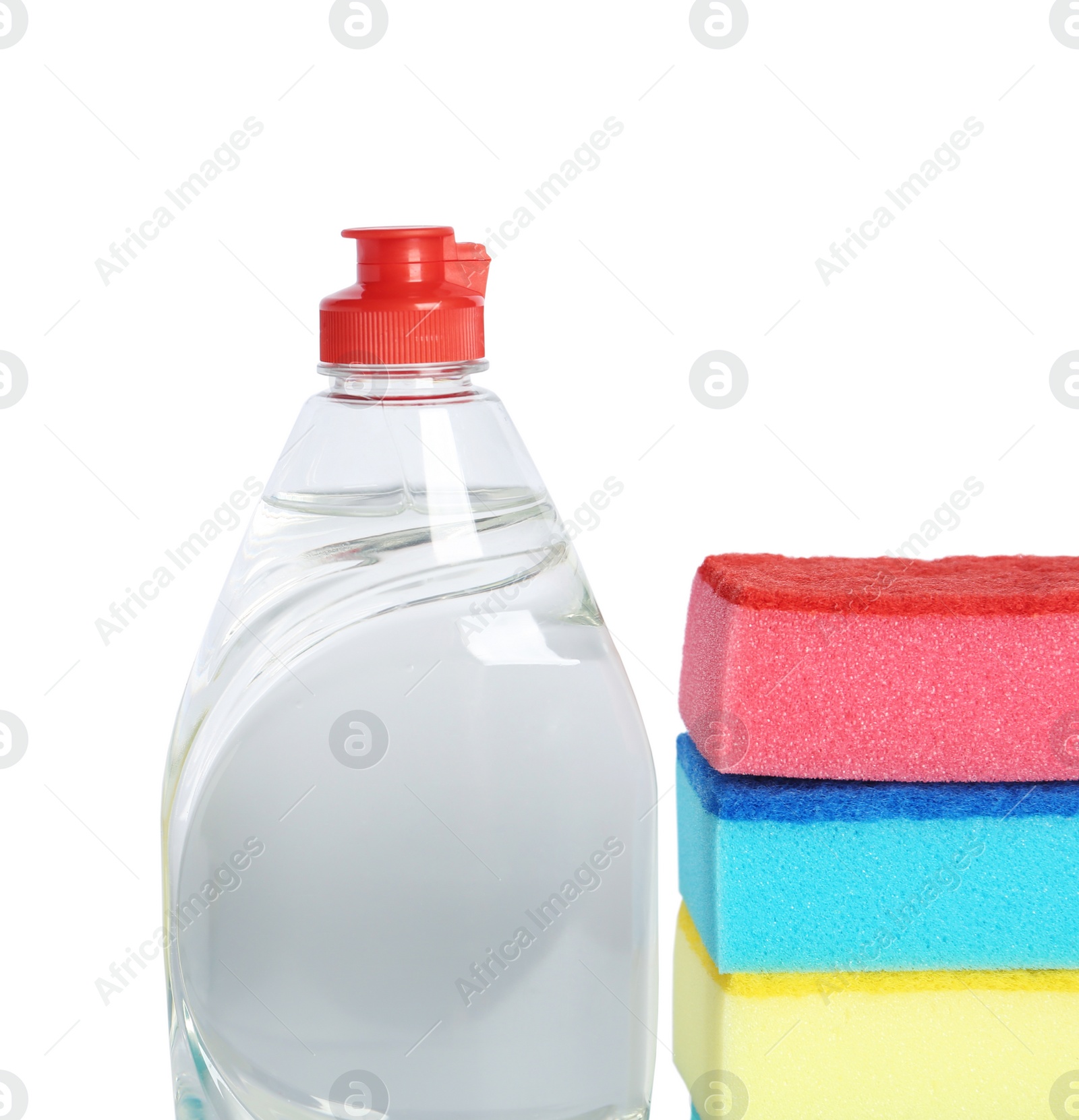 Photo of Bottle of detergent and sponges on white background