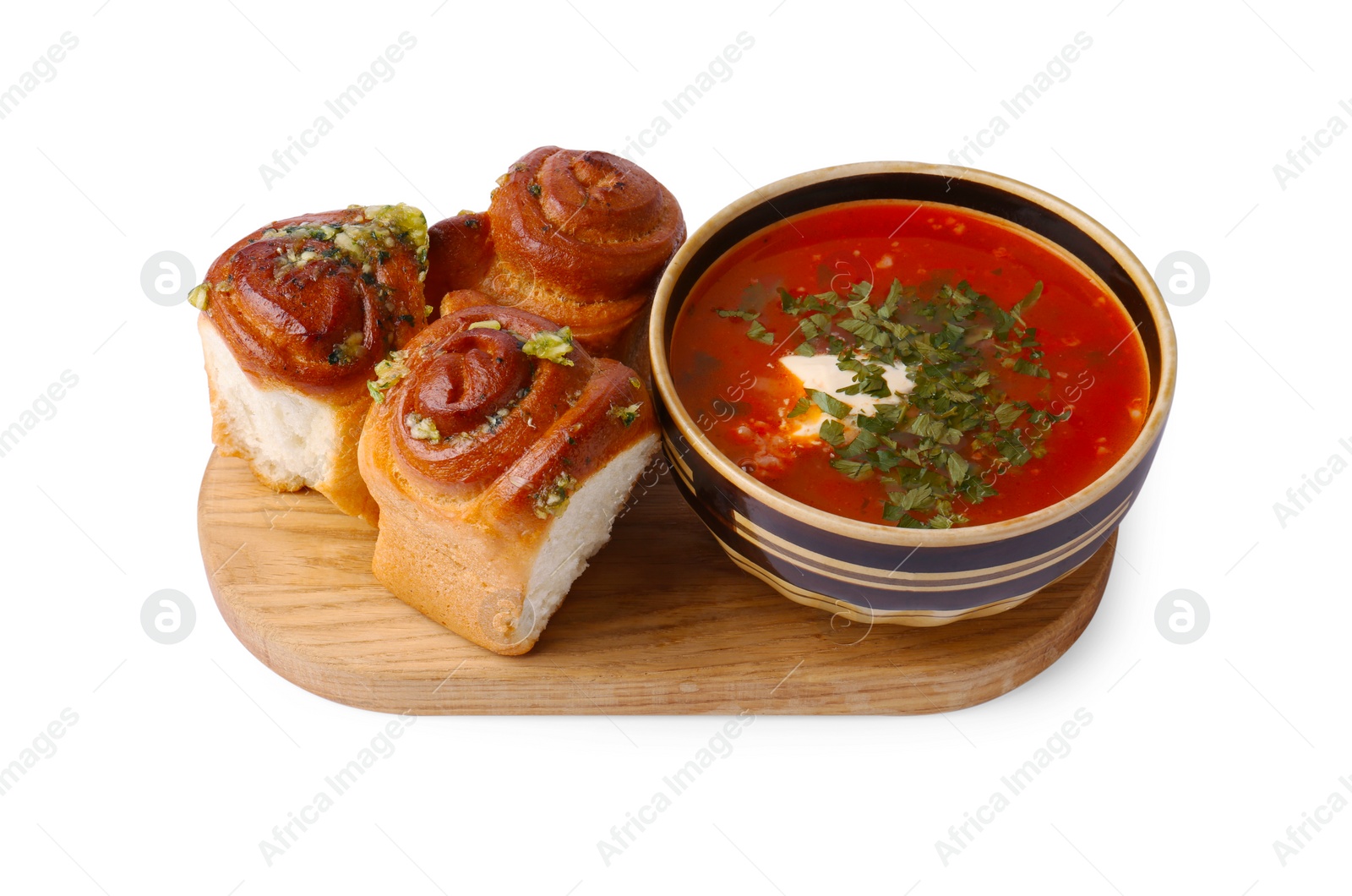 Photo of Tasty fresh pampushky and borsch. Traditional Ukrainian buns with garlic and beet soup isolated on white